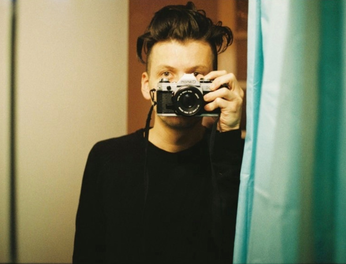 Miguel Peña — self-portrait with Canon 35mm camera